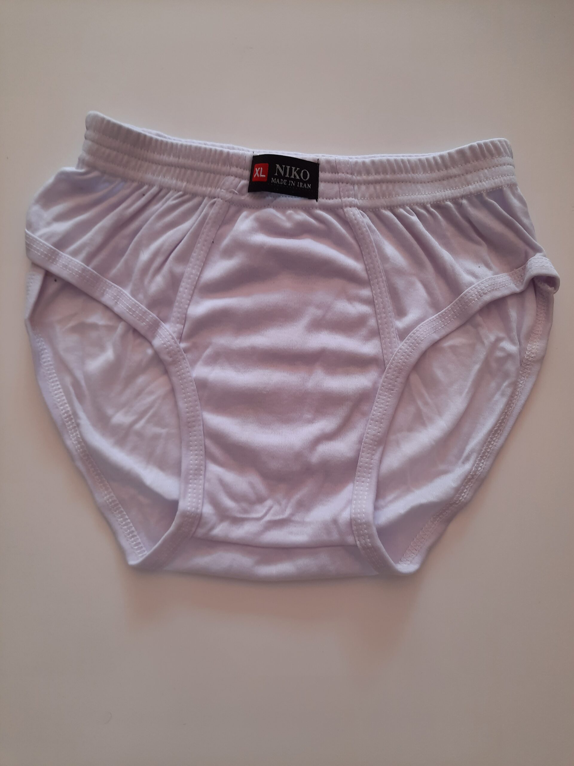 شورت نخی اسلیپ مردانه سفید برند نیکو (Niko) – سادگی، راحتی و کیفیت در یک طراحی کلاسیک 1 شورت نخی اسلیپ مردانه سفید برند نیکو (Niko) – سادگی، راحتی و کیفیت در یک طراحی کلاسیک